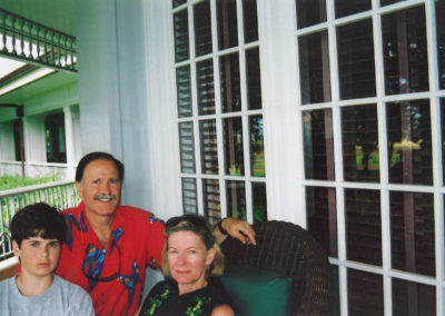 Lee and family sitting on a porch