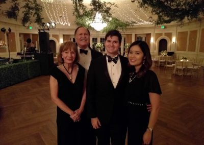 Lee with family at a formal event.